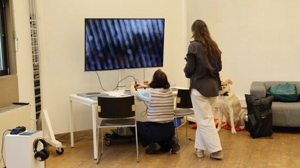 Two visitors at a station with a TV at the ÆSR Lab as part of the Long Night of Research 2026
