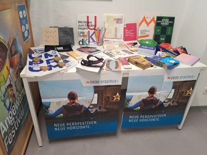 Table with goodies from our partner institutions from all over the world.